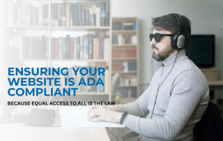 image of a blind person sitting at a table in the library using a computer
